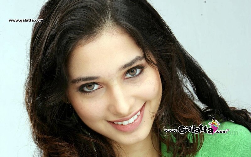 woman smiling in green top