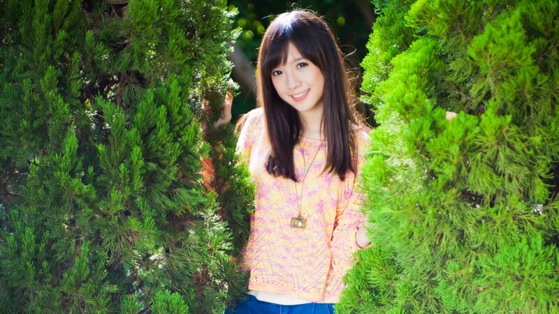 woman smiling in greenery