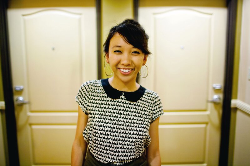 woman smiling in hallway