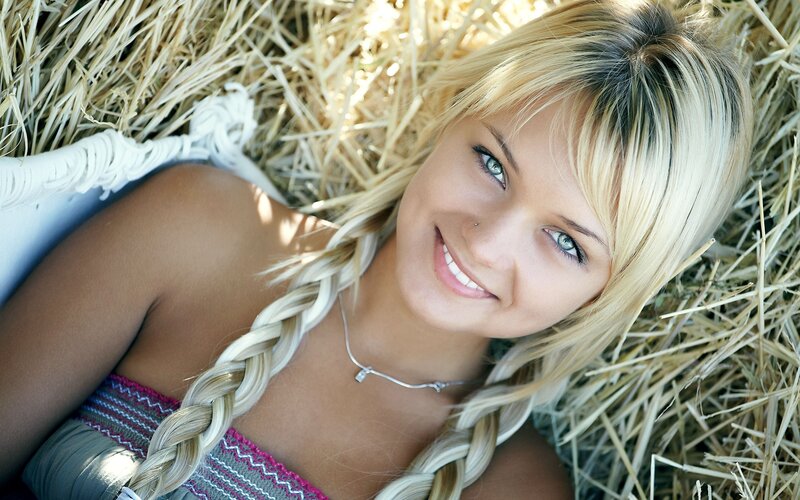 Woman smiling in hay