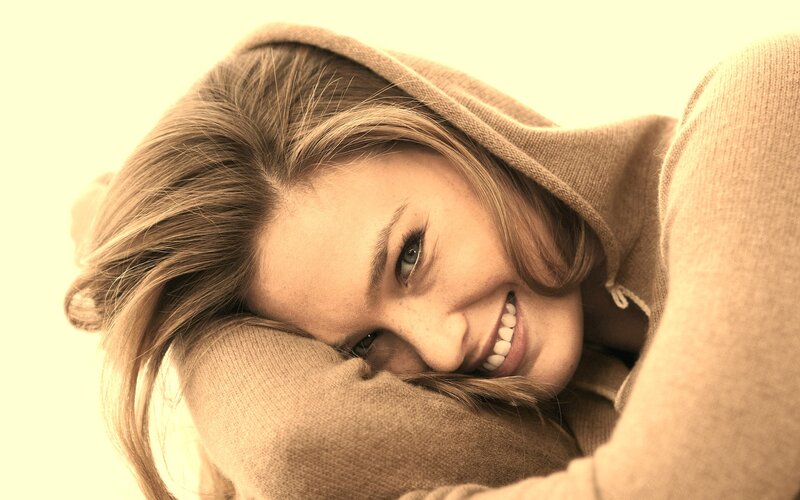 woman smiling in hoodie