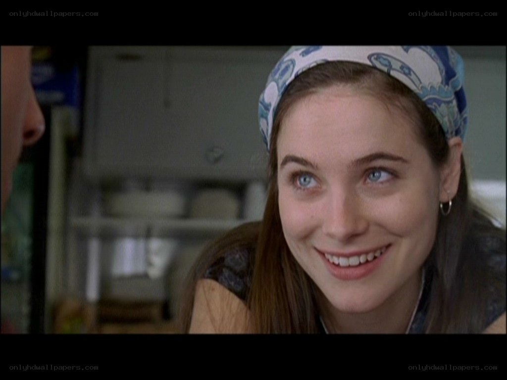woman smiling in kitchen