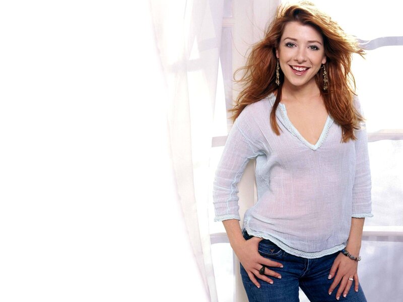 woman smiling in light shirt