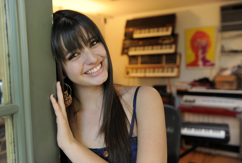 woman smiling in music room