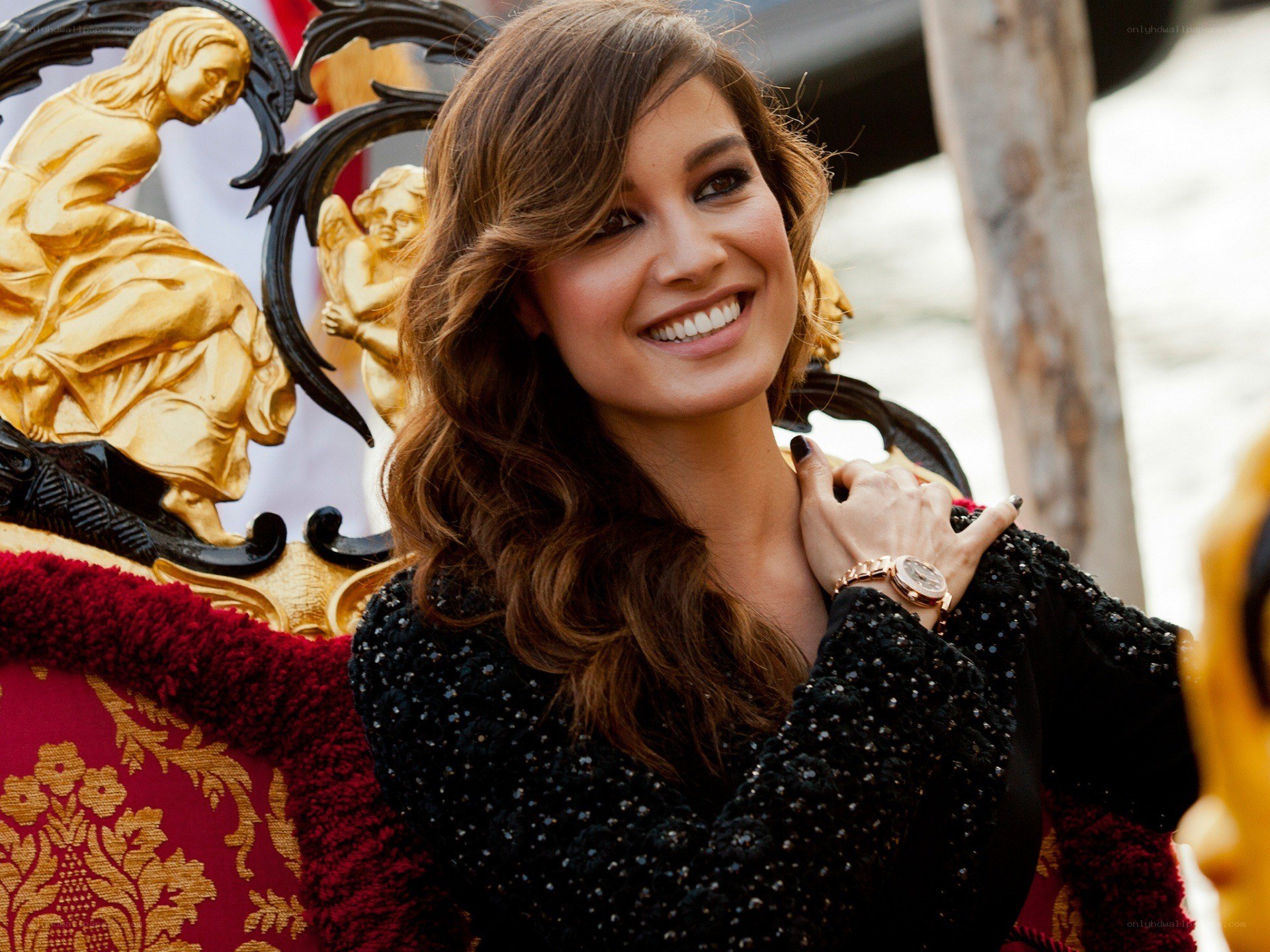 woman smiling in ornate setting