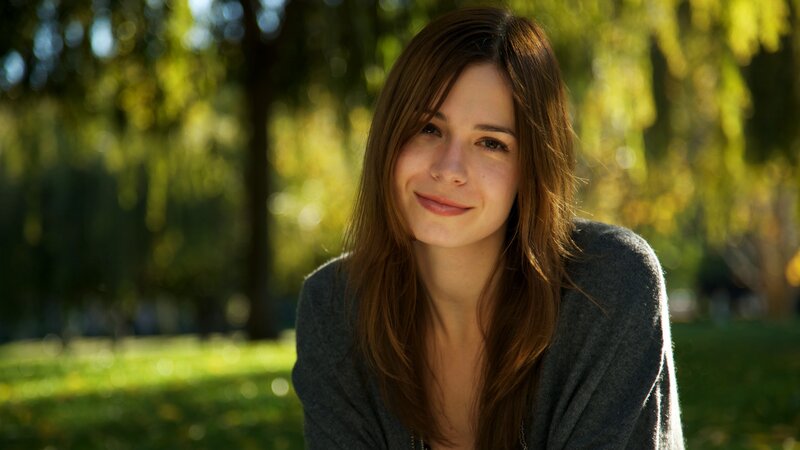 woman smiling in park