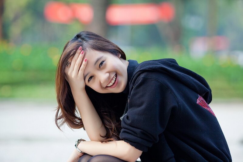 woman smiling in park