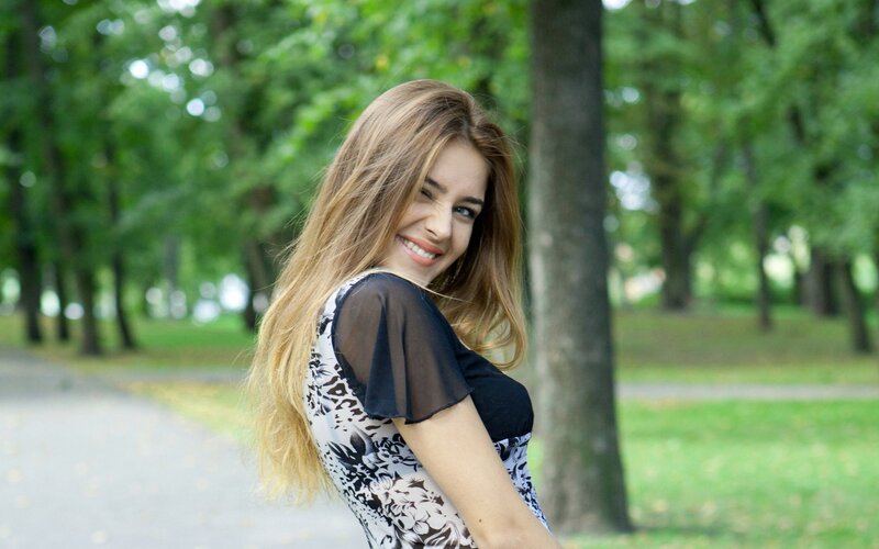 woman smiling in park