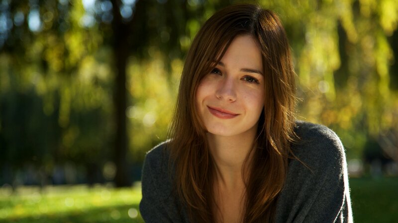woman smiling in park