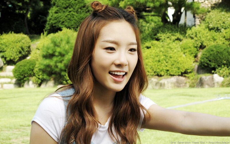 woman smiling in park