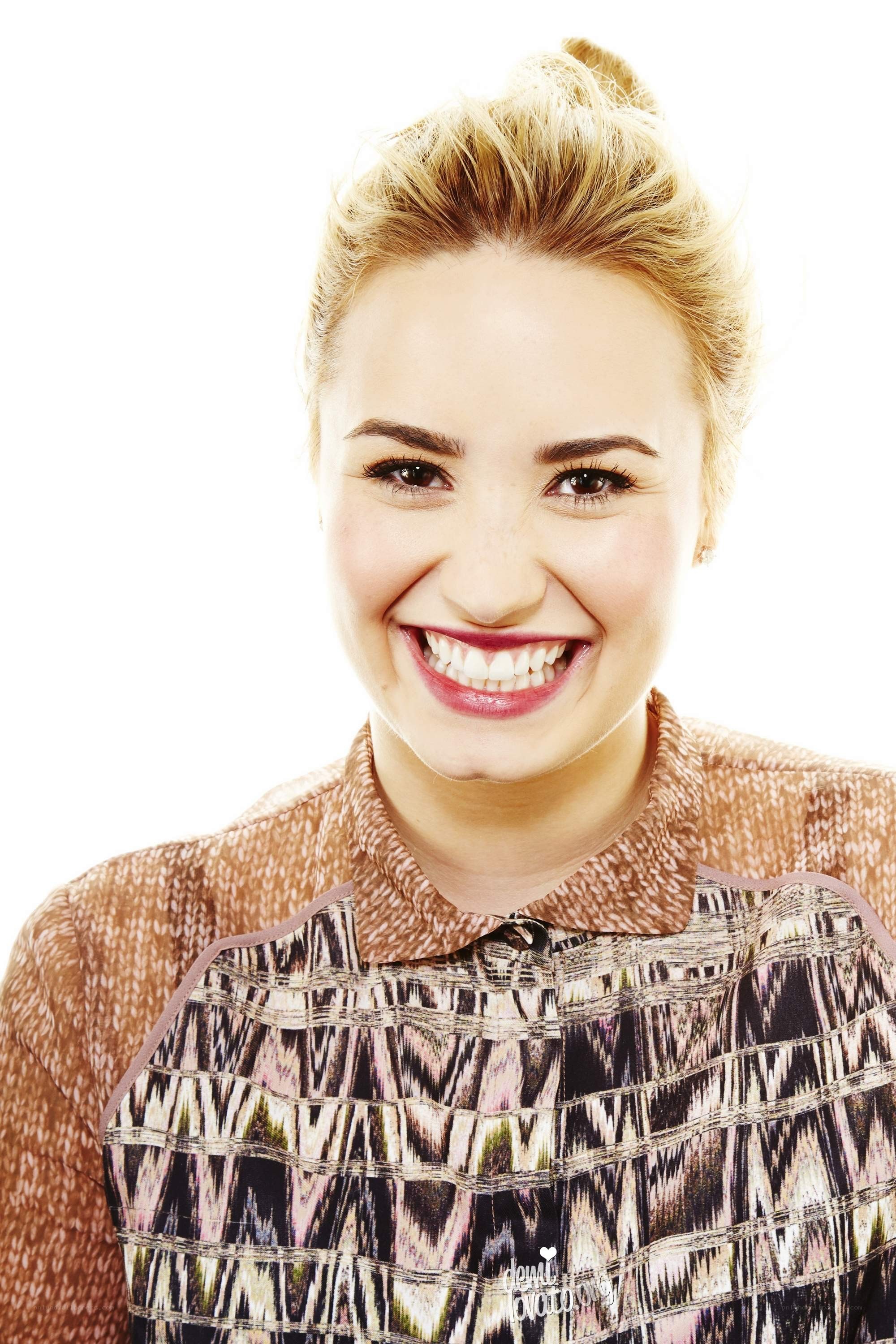 woman smiling in patterned top