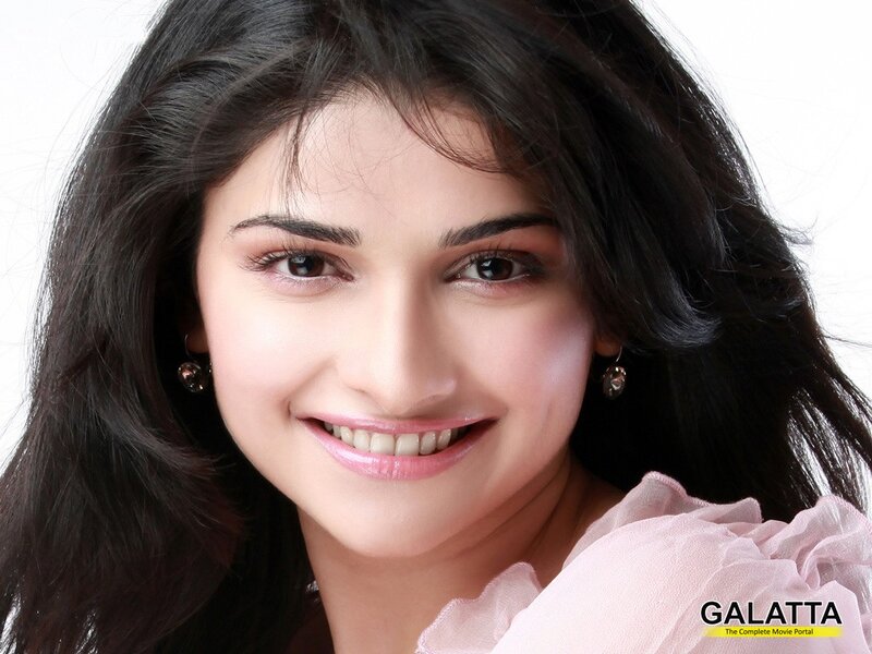 woman smiling in pink blouse