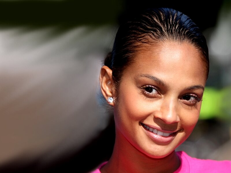 woman smiling in pink shirt