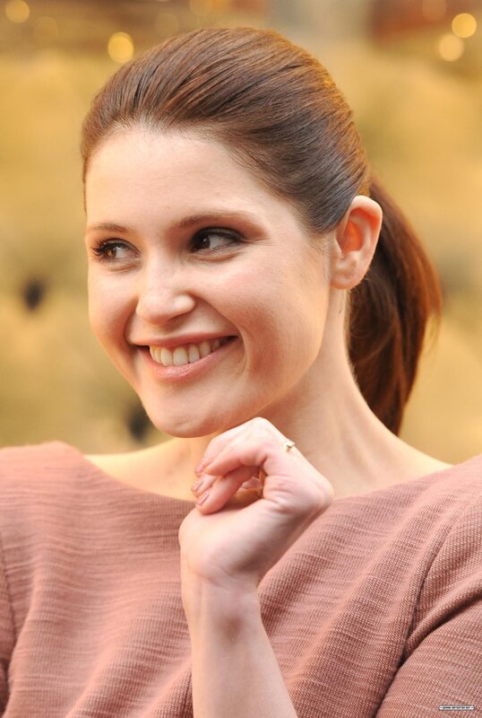 woman smiling in pink top