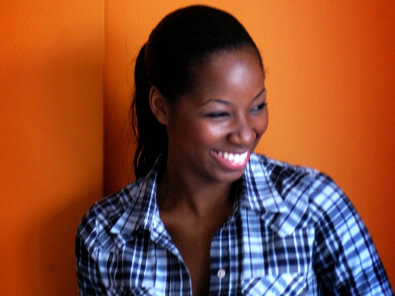woman smiling in plaid shirt