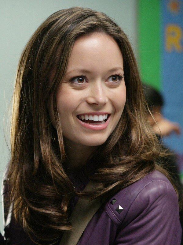 woman smiling in purple jacket