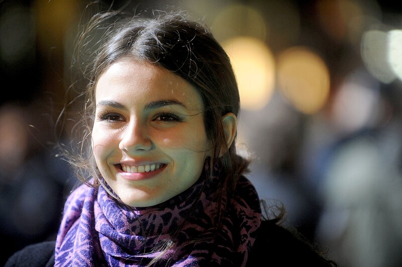 woman smiling in purple scarf