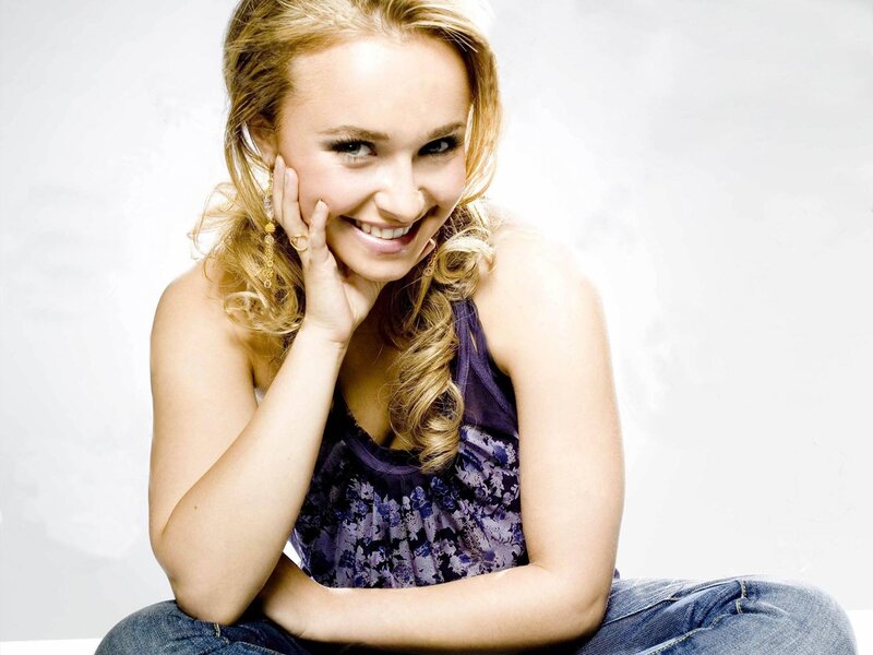 woman smiling in purple top