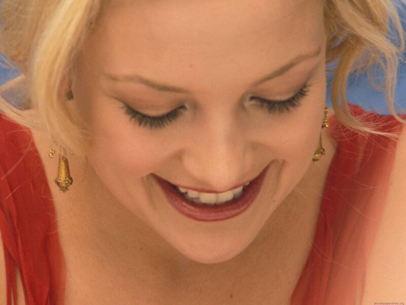 woman smiling in red dress