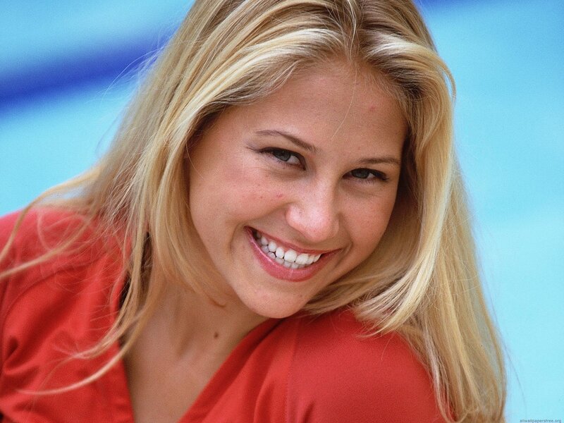 woman smiling in red shirt