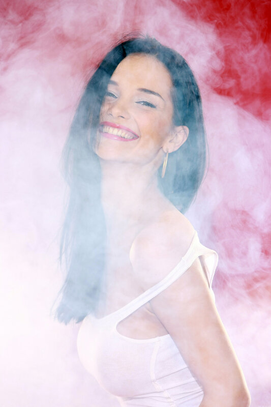 woman smiling in smoke