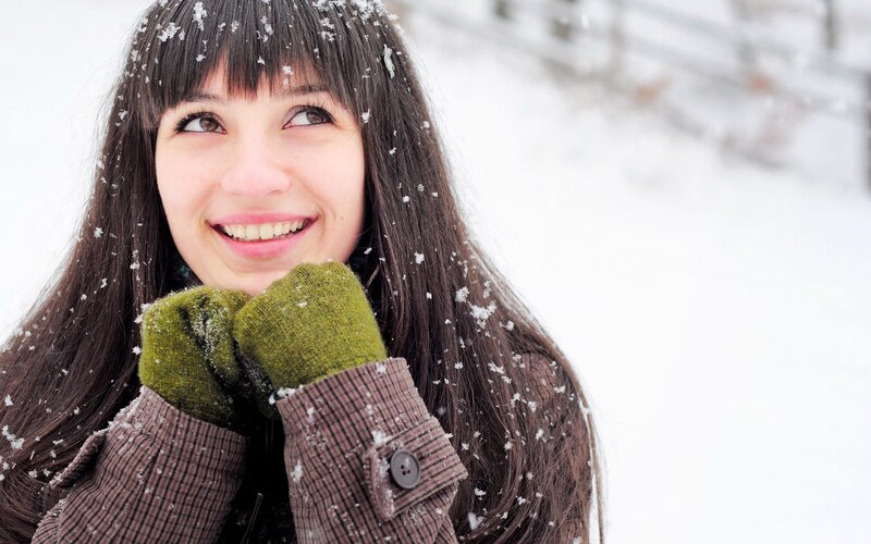 woman smiling in snow