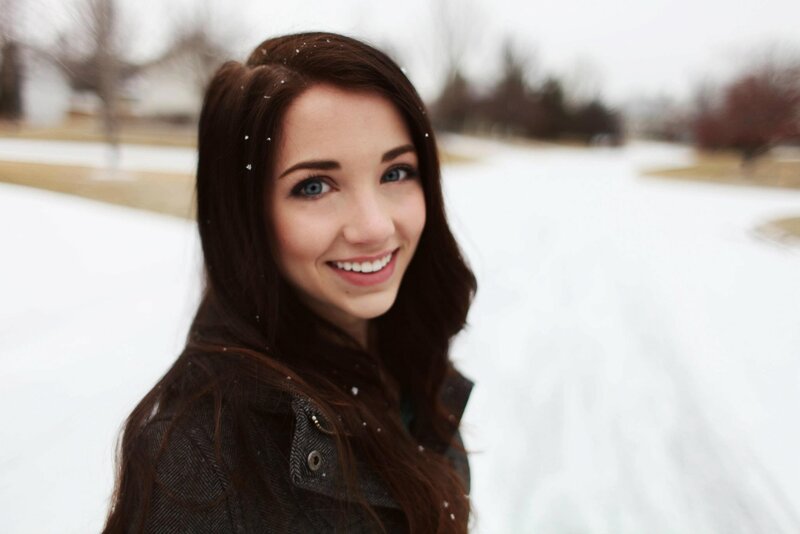 woman smiling in snowy landscape