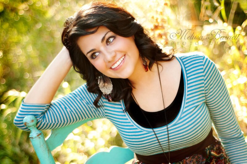 woman smiling in striped shirt