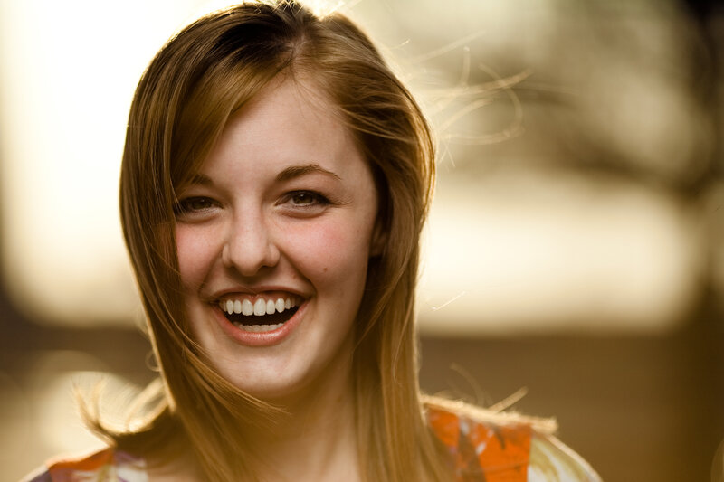 woman smiling in sunlight