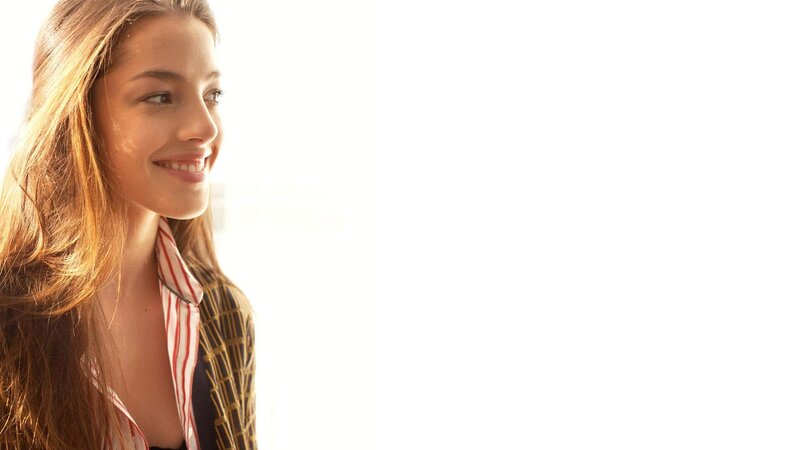 woman smiling in sunlight
