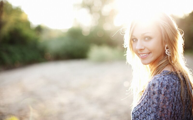 woman smiling in sunlight