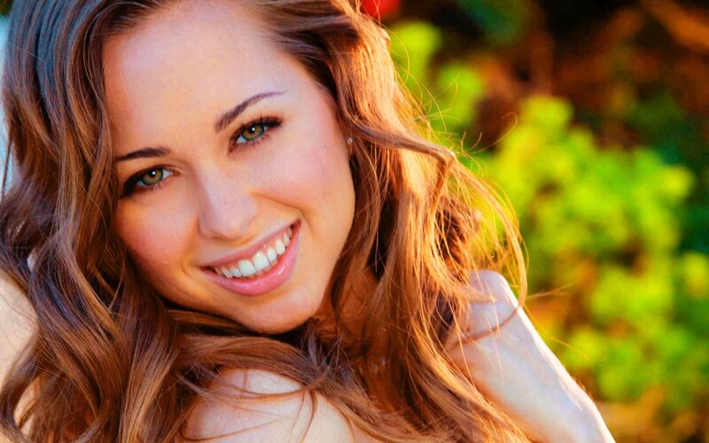 woman smiling in sunlight