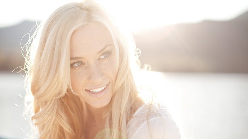 woman smiling in sunlight