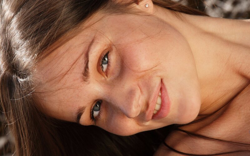 woman smiling in sunlight