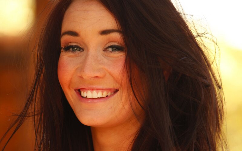 woman smiling in sunlight
