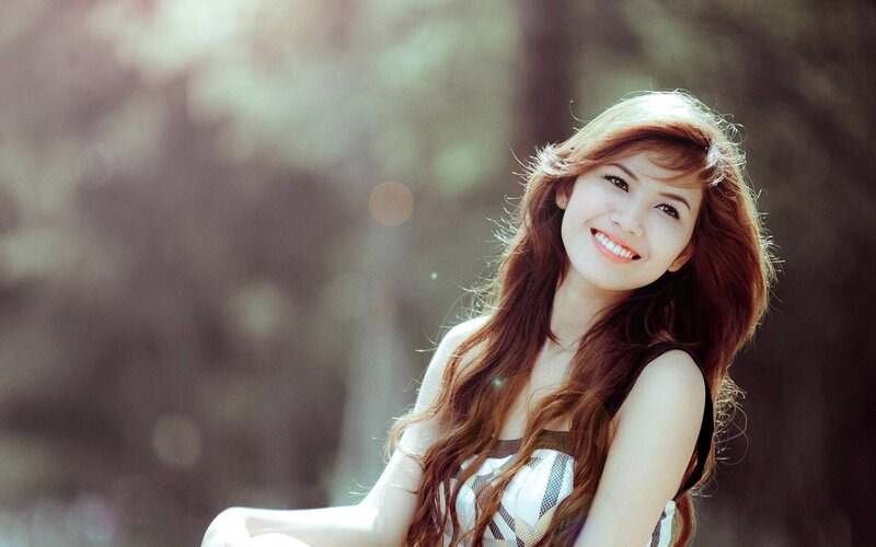 woman smiling in sunlight
