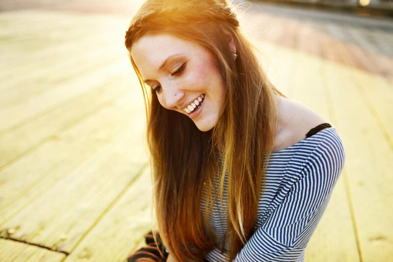 woman smiling in sunlight
