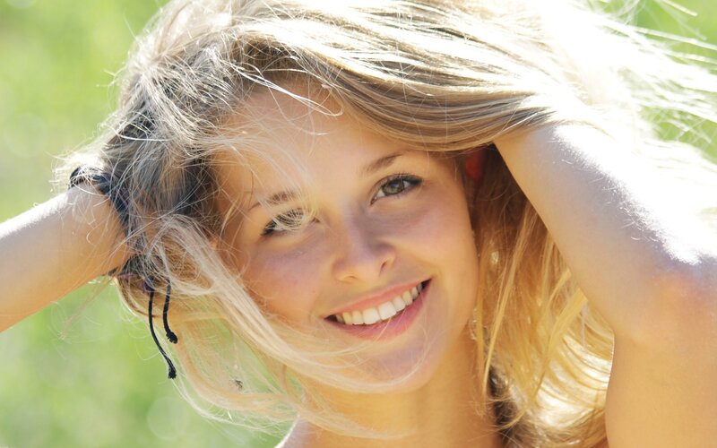 woman smiling in sunlight
