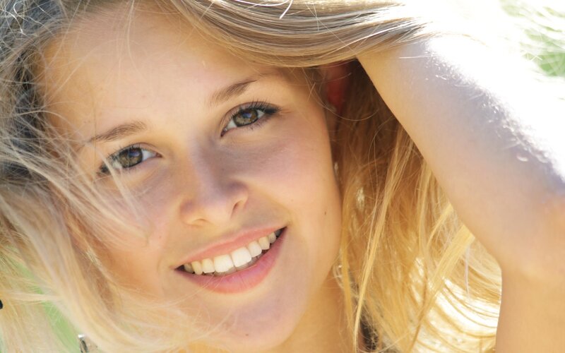 woman smiling in sunlight