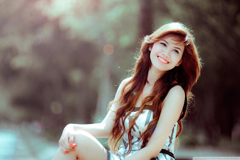 woman smiling in sunlight