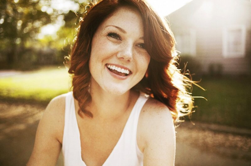 woman smiling in sunlight
