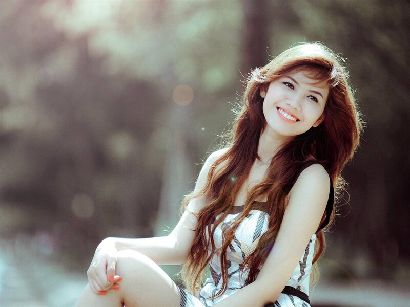 woman smiling in sunlight