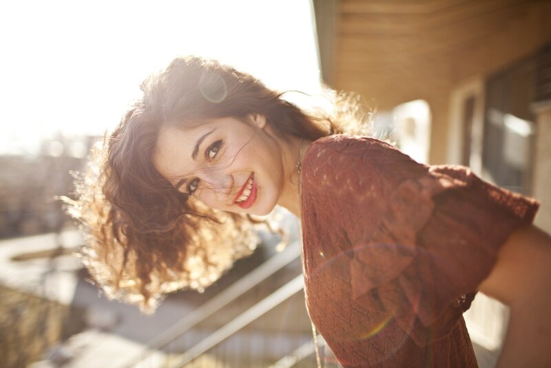 woman smiling in sunlight