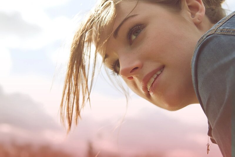 woman smiling in sunlight