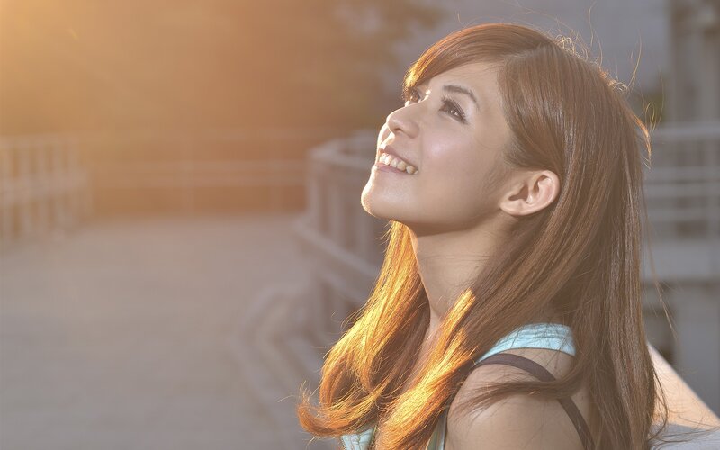 woman smiling in sunlight