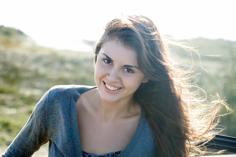 woman smiling in sunlight