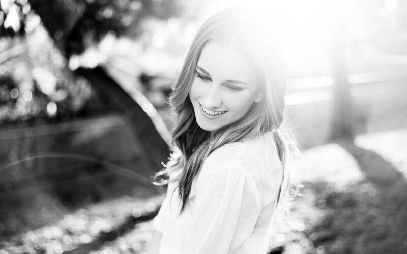 woman smiling in sunlight