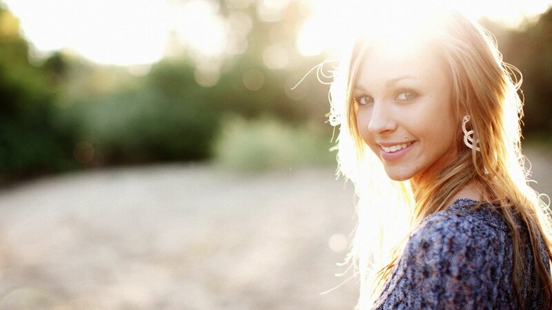 woman smiling in sunlight