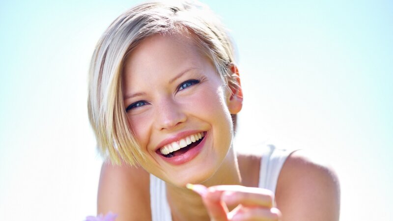 woman smiling in sunlight