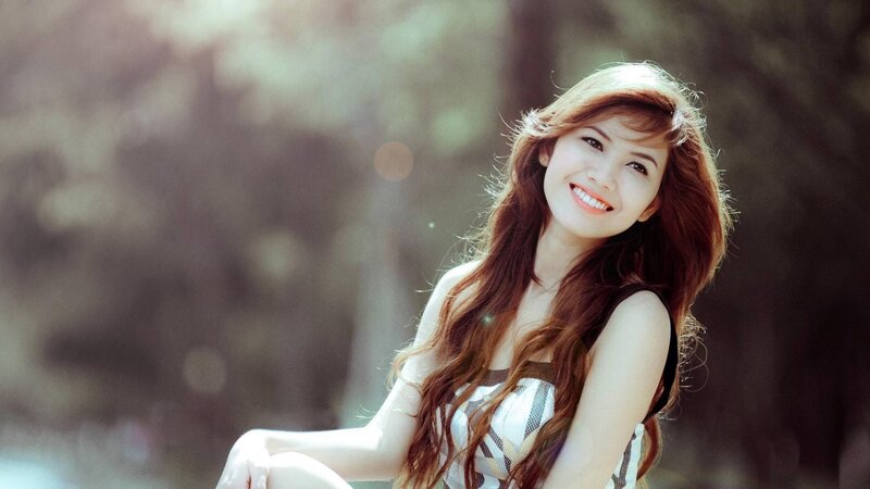 woman smiling in sunlight